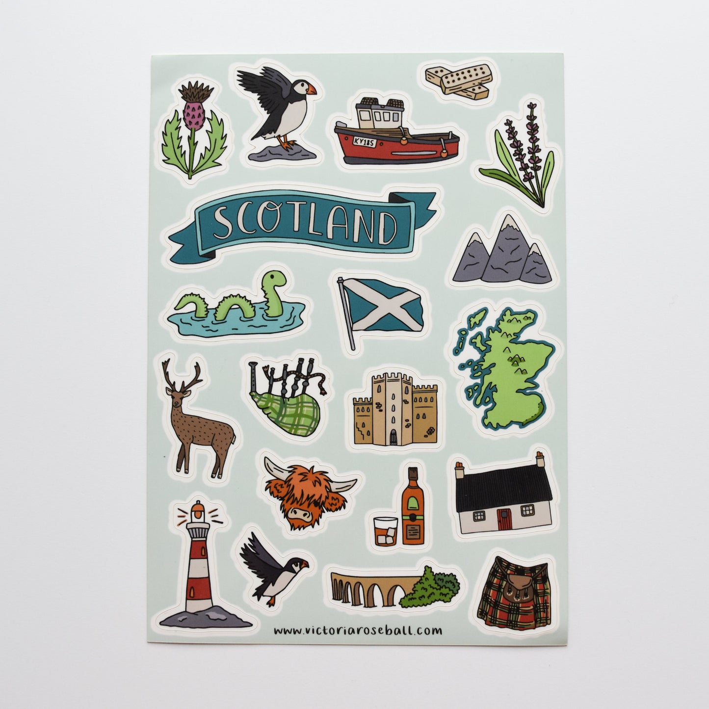 Sheet of Scottish-themed stickers with various icons on a light gray background