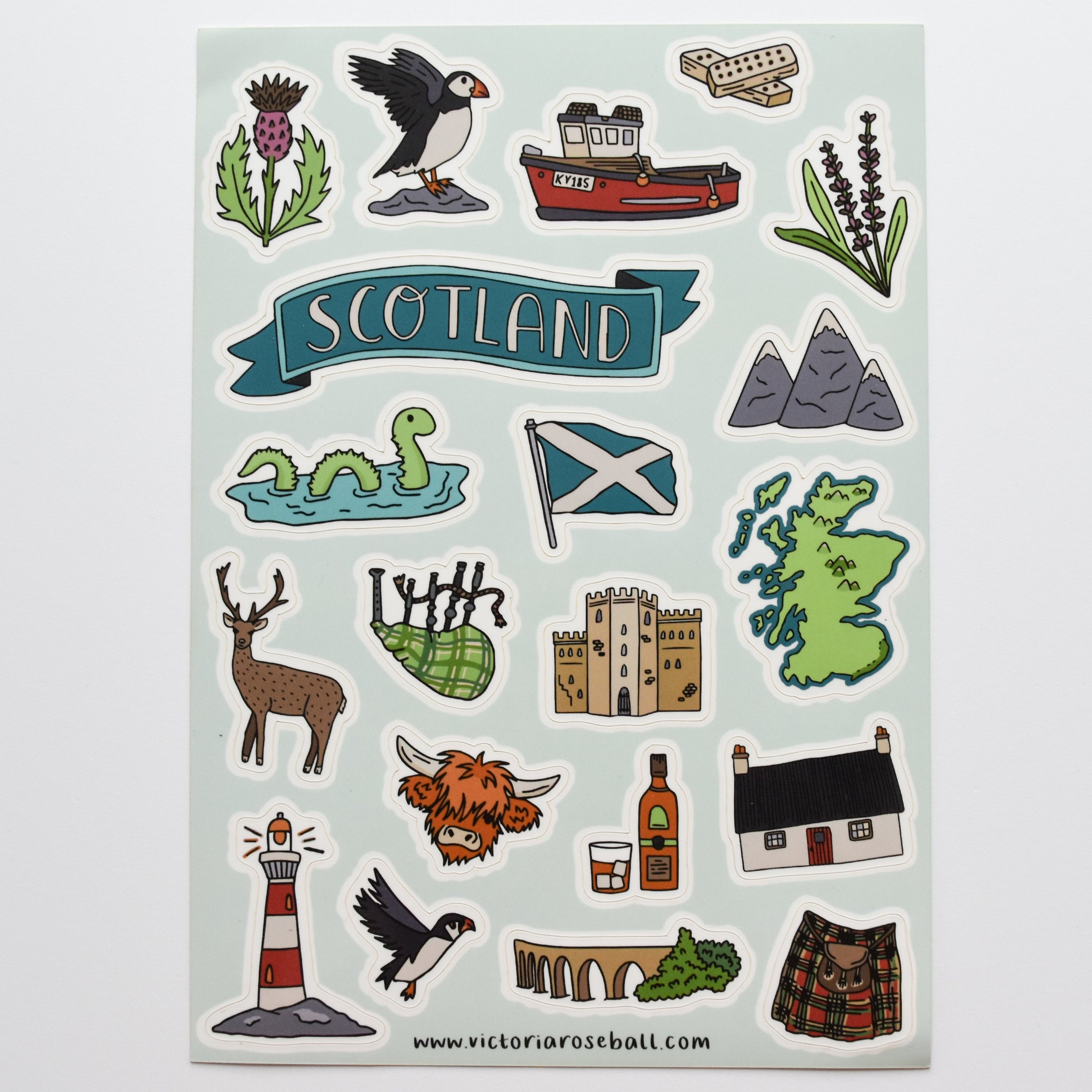 Sheet of Scottish-themed stickers with various icons on a light gray background